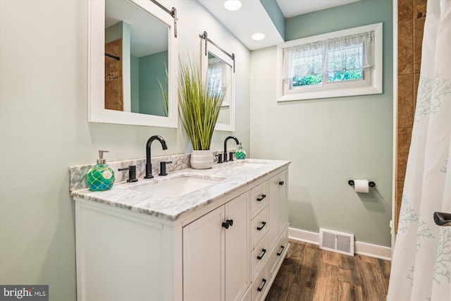 7912 Glengary Ct, Glen Burnie, MD 21061 - bathroom featuring double vanity, wood finished floors, baseboards, and a shower with curtain