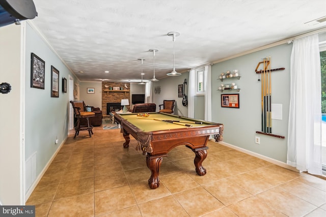 7912 Glengary Ct, Glen Burnie, MD 21061 - playroom with plenty of natural light, a fireplace, billiards table, light tile patterned floors, and ornamental molding