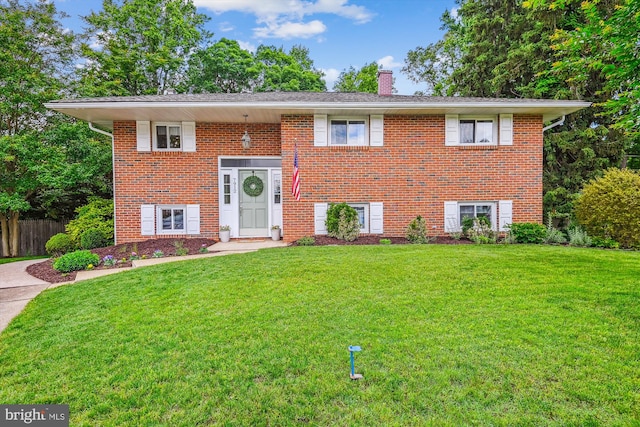 7912 Glengary Ct, Glen Burnie, MD 21061 - split foyer home with a chimney and brick siding