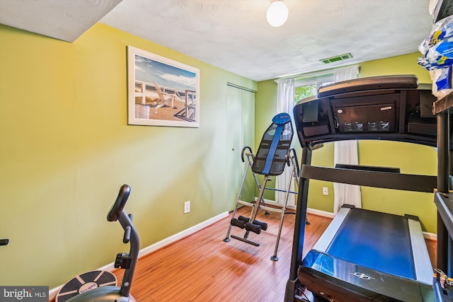 7912 Glengary Ct, Glen Burnie, MD 21061 - workout area featuring wood finished floors and baseboards