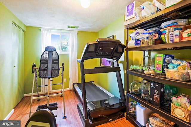 7912 Glengary Ct, Glen Burnie, MD 21061 - workout room with wood finished floors and baseboards
