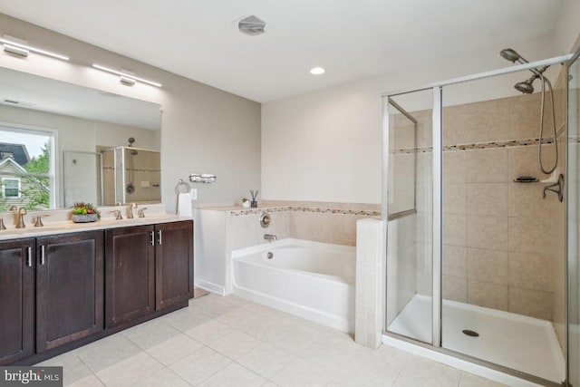 42004 Donnington Pl, Ashburn, VA 20148 - bathroom featuring a shower stall, a garden tub, double vanity, tile patterned flooring, and recessed lighting