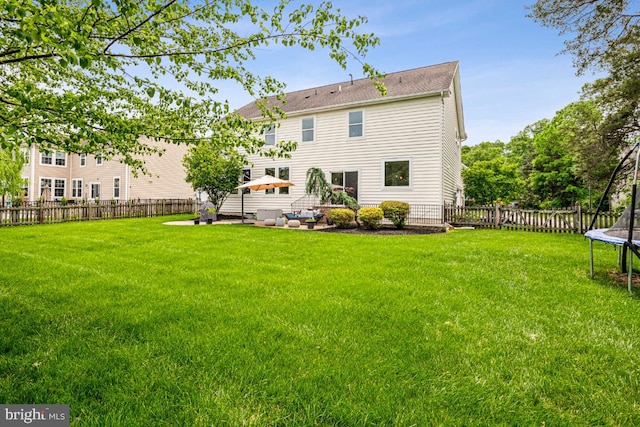 42004 Donnington Pl, Ashburn, VA 20148 - back of house with a trampoline and a patio