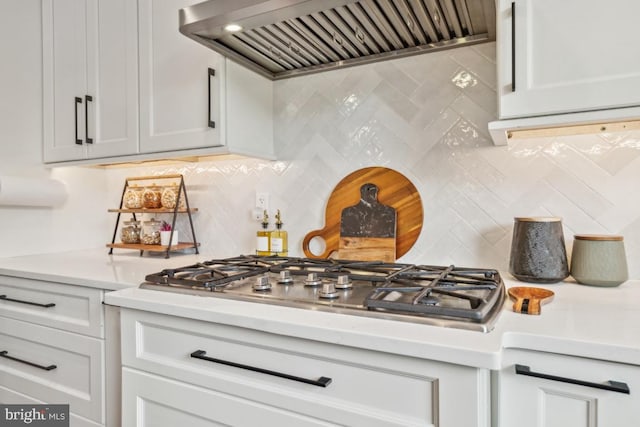42004 Donnington Pl, Ashburn, VA 20148 - kitchen with custom range hood, decorative backsplash, light countertops, and stainless steel gas cooktop
