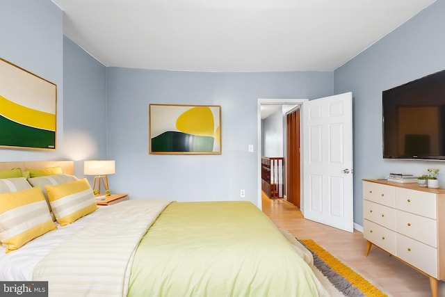 bedroom with wood finished floors