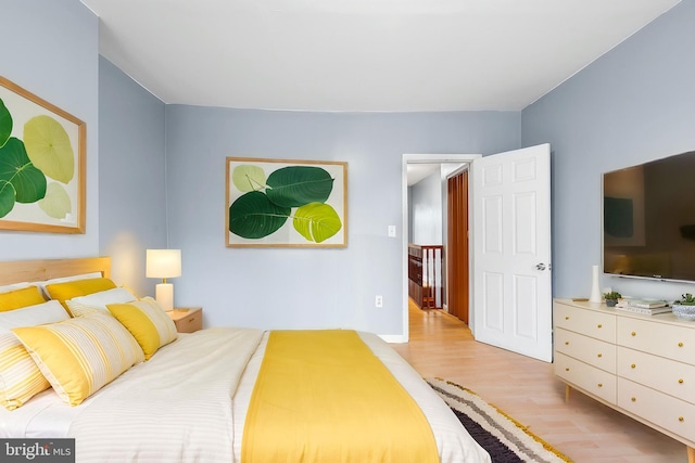 bedroom with light wood-style flooring