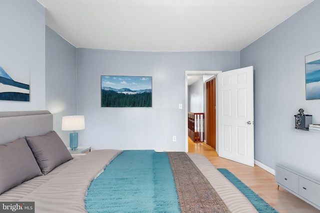 bedroom featuring wood finished floors