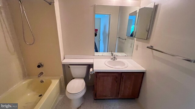 bathroom featuring tile patterned floors, vanity, shower / bath combination, and toilet