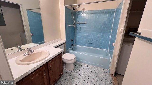 bathroom featuring vanity, toilet, and bathing tub / shower combination