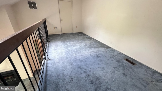 spare room featuring carpet flooring