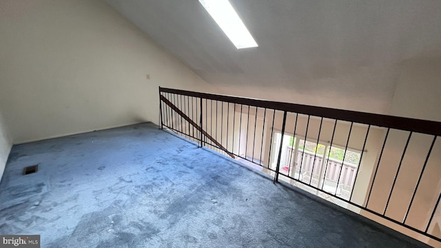 bonus room featuring lofted ceiling and carpet