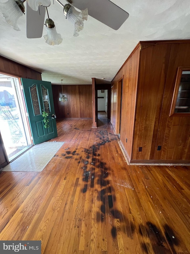 301 Ohio St, Boswell, PA 15531 - entrance foyer featuring wood-type flooring, wood walls, and a ceiling fan