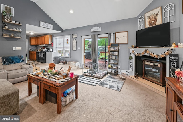 living room with light colored carpet, a fireplace, recessed lighting, and high vaulted ceiling