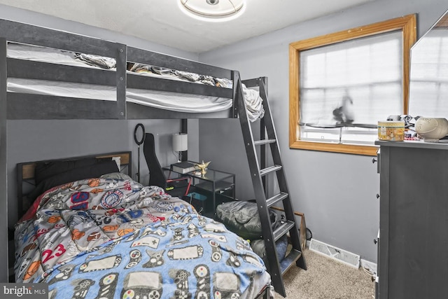 carpeted bedroom with baseboards
