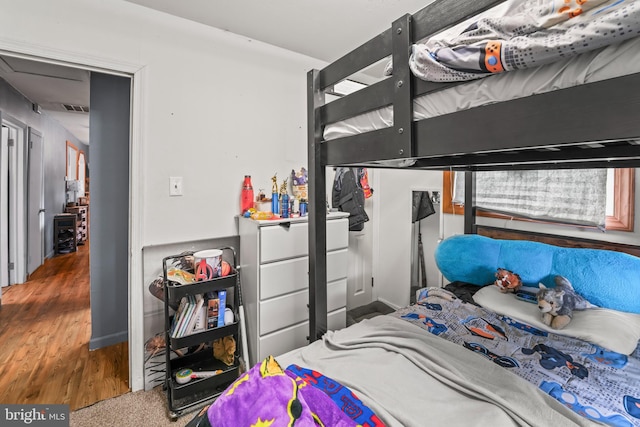 bedroom with wood finished floors