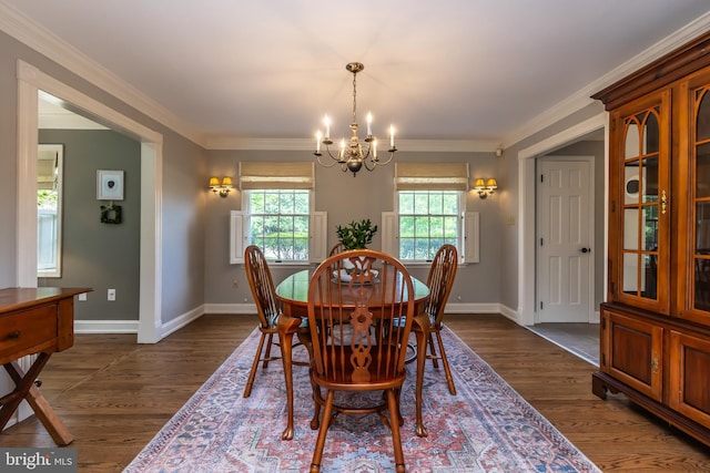 dining area featuring a chandelier, baseboards, dark wood-style flooring, and crown molding