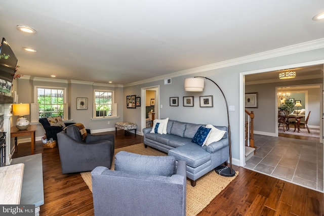 living area featuring crown molding, recessed lighting, wood finished floors, baseboards, and a premium fireplace