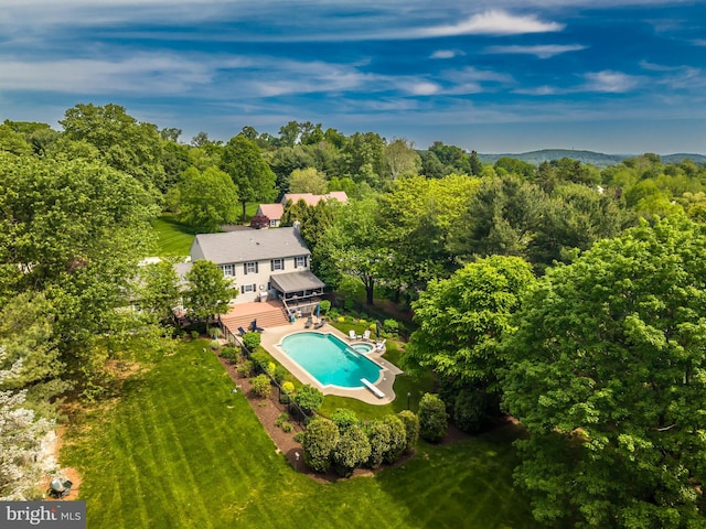 view of subject property featuring a pool area