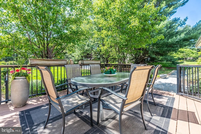 deck featuring outdoor dining area