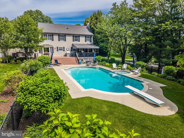 view of pool featuring a deck, a patio, a diving board, stairway, and a pool with connected hot tub