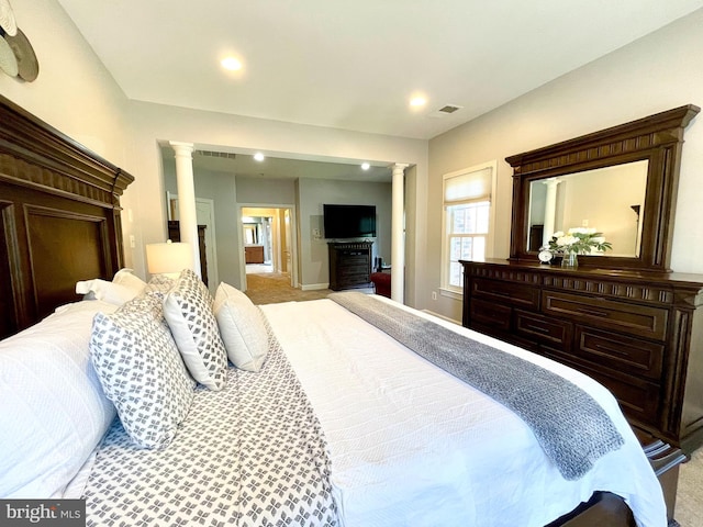 bedroom with ornate columns, recessed lighting, carpet, and baseboards