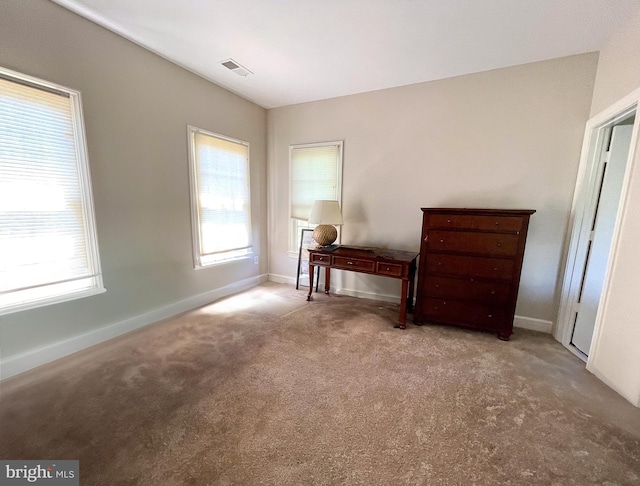 bedroom with carpet floors and baseboards