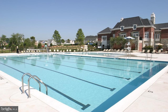 community pool with a patio