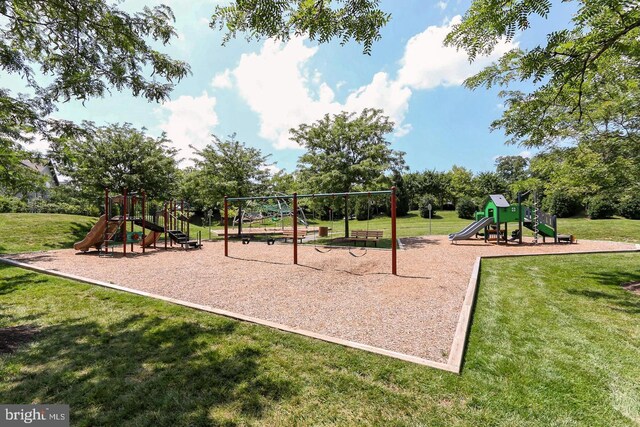 community jungle gym featuring a lawn