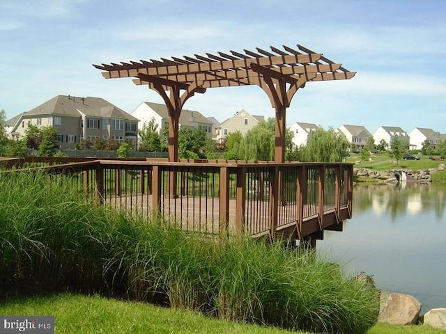dock area featuring a residential view, a pergola, and a deck with water view