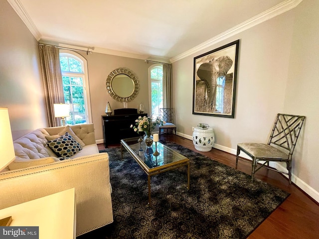 sitting room featuring crown molding, wood finished floors, and baseboards
