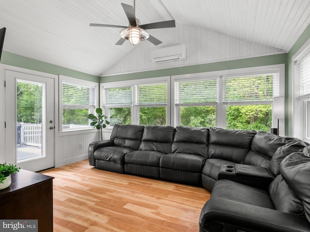 51 Seminary Rd, Glenmoore, PA 19343 - living area featuring lofted ceiling, a wall mounted air conditioner, ceiling fan, and light wood finished floors