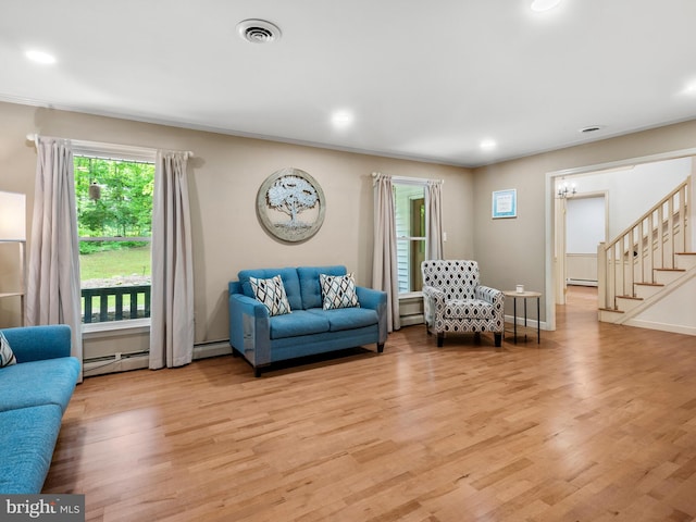 51 Seminary Rd, Glenmoore, PA 19343 - living area with a baseboard radiator, light wood-style flooring, stairway, and recessed lighting