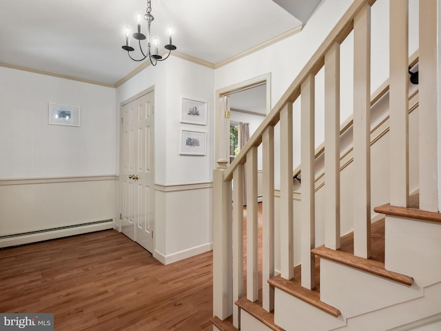 51 Seminary Rd, Glenmoore, PA 19343 - foyer entrance with stairway, wood finished floors, ornamental molding, a chandelier, and a baseboard heating unit
