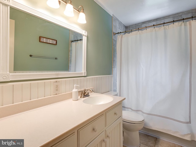 51 Seminary Rd, Glenmoore, PA 19343 - bathroom featuring toilet, vanity, tile patterned floors, and wainscoting