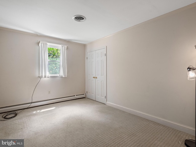 51 Seminary Rd, Glenmoore, PA 19343 - carpeted empty room with a baseboard radiator, crown molding, and baseboards