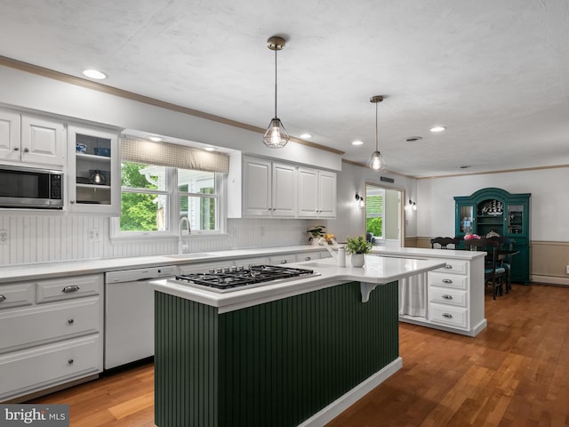 51 Seminary Rd, Glenmoore, PA 19343 - kitchen with stainless steel appliances, a sink, a kitchen island, white cabinetry, and recessed lighting