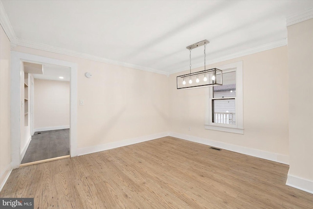 8422 Newark Rd, Newark, MD 21841 - unfurnished dining area featuring crown molding, wood finished floors, baseboards, and a chandelier