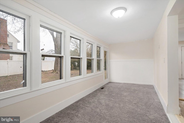 8422 Newark Rd, Newark, MD 21841 - unfurnished sunroom featuring carpet and baseboards