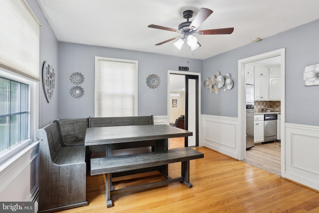 430 W Palmer St, Morrisville, PA 19067 - dining room with light wood-style floors, ceiling fan, and a wainscoted wall