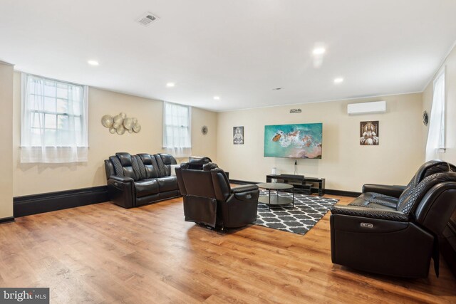 430 W Palmer St, Morrisville, PA 19067 - living area with a wall mounted AC, light wood-style flooring, recessed lighting, and baseboards