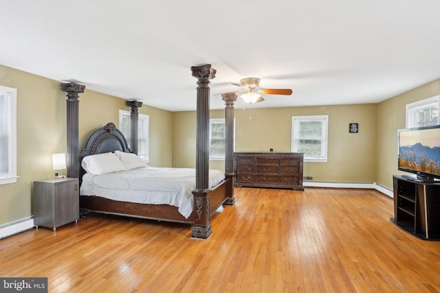430 W Palmer St, Morrisville, PA 19067 - bedroom with light wood-style flooring, multiple windows, a baseboard radiator, and decorative columns