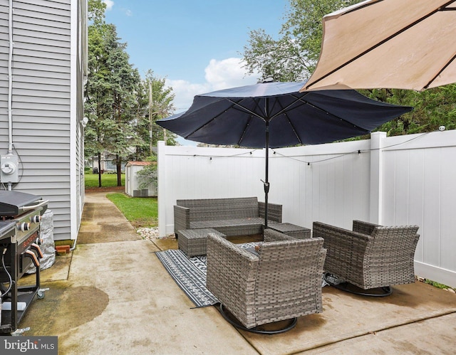 430 W Palmer St, Morrisville, PA 19067 - view of patio / terrace with a fenced backyard, an outdoor living space, a grill, an outbuilding, and a shed