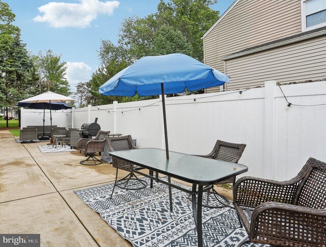 430 W Palmer St, Morrisville, PA 19067 - view of patio featuring outdoor dining space, a fenced backyard, and grilling area
