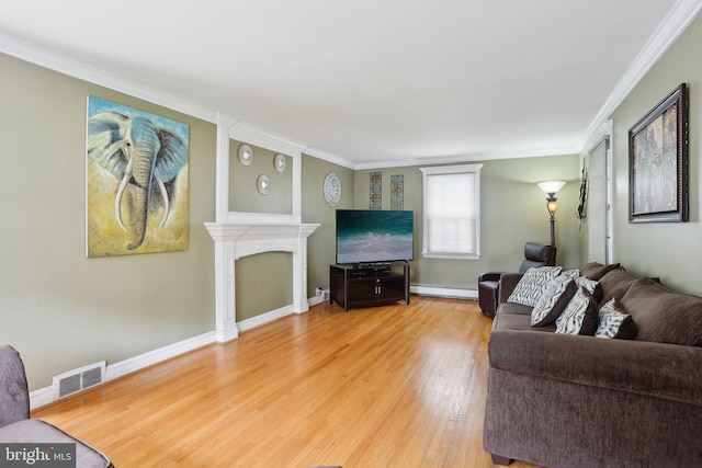 430 W Palmer St, Morrisville, PA 19067 - living room featuring light wood-style floors, ornamental molding, a fireplace, baseboard heating, and baseboards