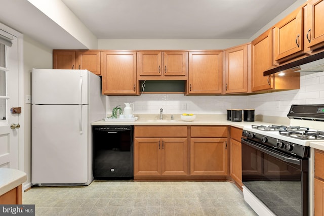 6008 Hawthorne St, Cheverly, MD 20785 - kitchen featuring gas range, black dishwasher, freestanding refrigerator, light countertops, and backsplash