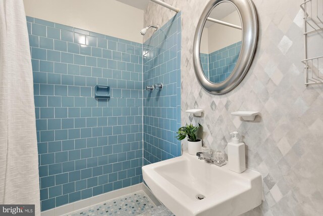6008 Hawthorne St, Cheverly, MD 20785 - full bathroom with a sink, tiled shower, and tile walls