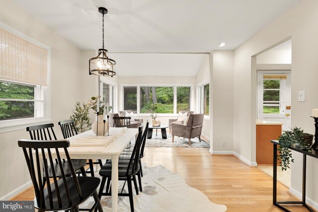 6008 Hawthorne St, Cheverly, MD 20785 - dining room with light wood-style flooring, a chandelier, and baseboards