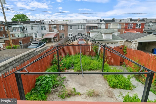 exterior space featuring a residential view and a fenced backyard