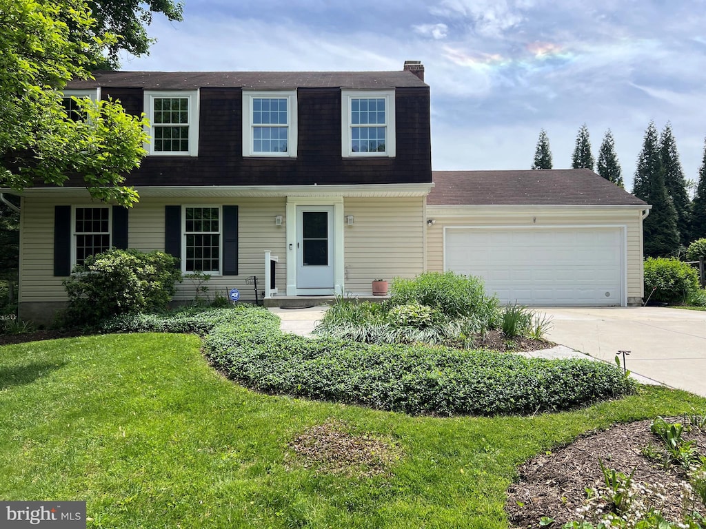8343 Tally Ho Rd, Lutherville Timonium, MD 21093 - dutch colonial featuring a garage, driveway, a front yard, a chimney, and a shingled roof