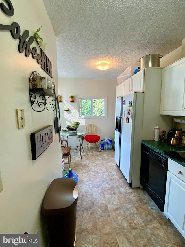 kitchen featuring white refrigerator with ice dispenser, black dishwasher, white cabinetry, dark countertops, and a textured ceiling
